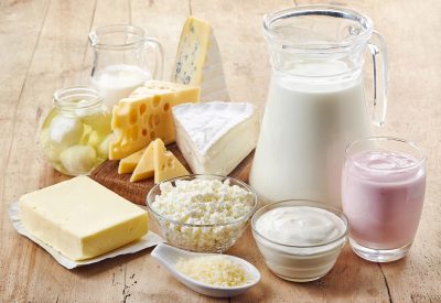 Various fresh dairy products on wooden background